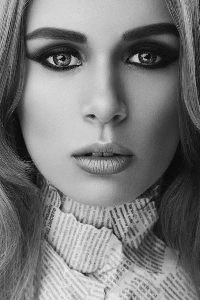 Monochrome closeup art beauty portrait of young beautiful woman blond girl with long straight hair with natural makeup. Hairstyle and skincare and cosmetics concept