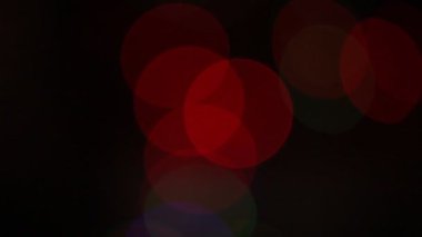 Yuvarlak Bokeh Noel 'i ve mutlu yıllar ışıltılı ışıklar. Siyah arkaplan ile soyut bokeh