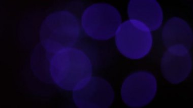Yuvarlak Bokeh Noel 'i ve mutlu yıllar ışıltılı ışıklar. Siyah arkaplan ile soyut bokeh