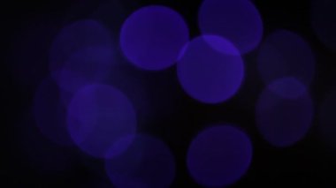 Yuvarlak Bokeh Noel 'i ve mutlu yıllar ışıltılı ışıklar. Siyah arkaplan ile soyut bokeh