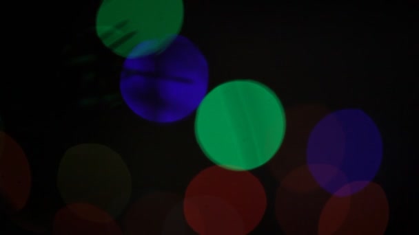 Bokeh circulaire Noël et Bonne année scintille lumières. Bokeh abstrait avec fond noir 