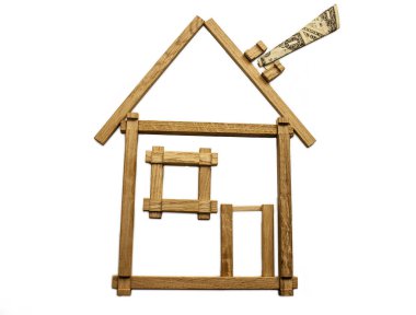 Beyaz bir arka plan üzerinde çocuk ahşap tuğla yapılmış ev