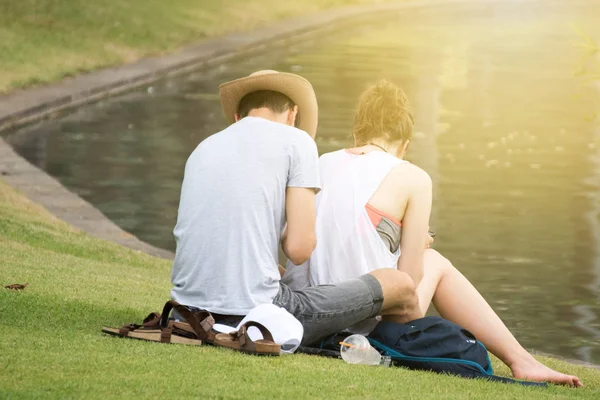 In love couple laying in public park