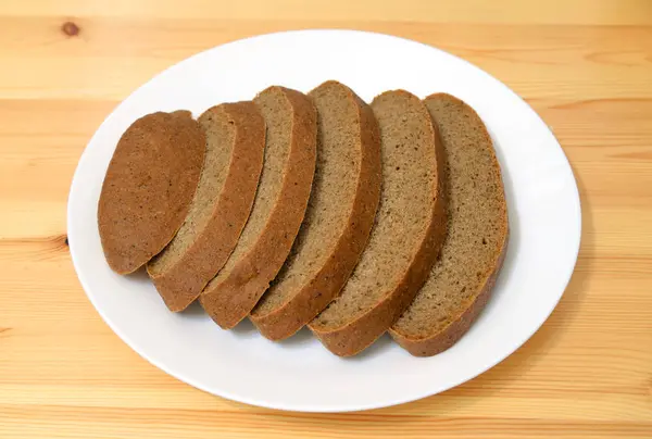 Sliced bread on plate. — Stock Photo, Image