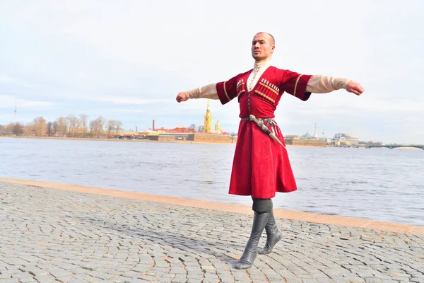 Men in national Caucasian costumes is dancing lezginka. — Stock Photo, Image
