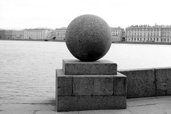 Granite ball on embankment of Neva river. — Stock Photo, Image