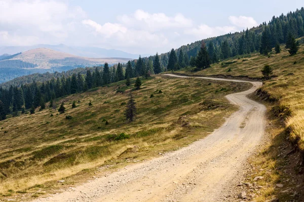 Rural road in mountains — Stock Photo, Image