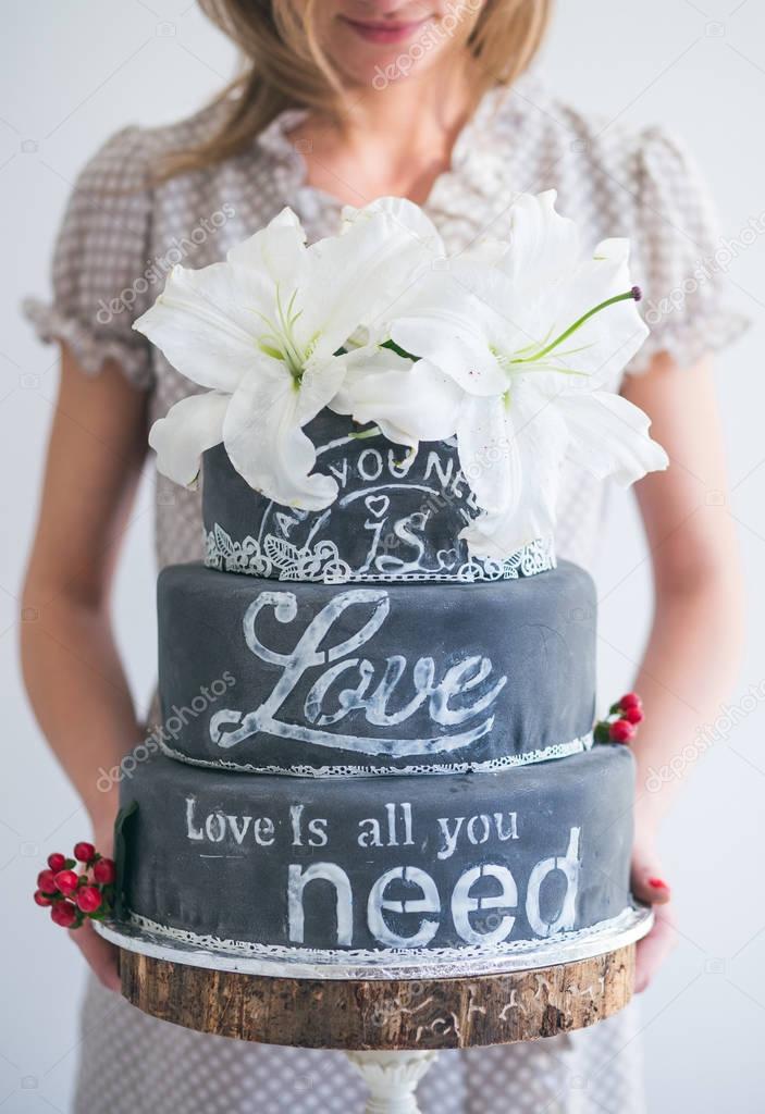 Woman holding Wedding cake 