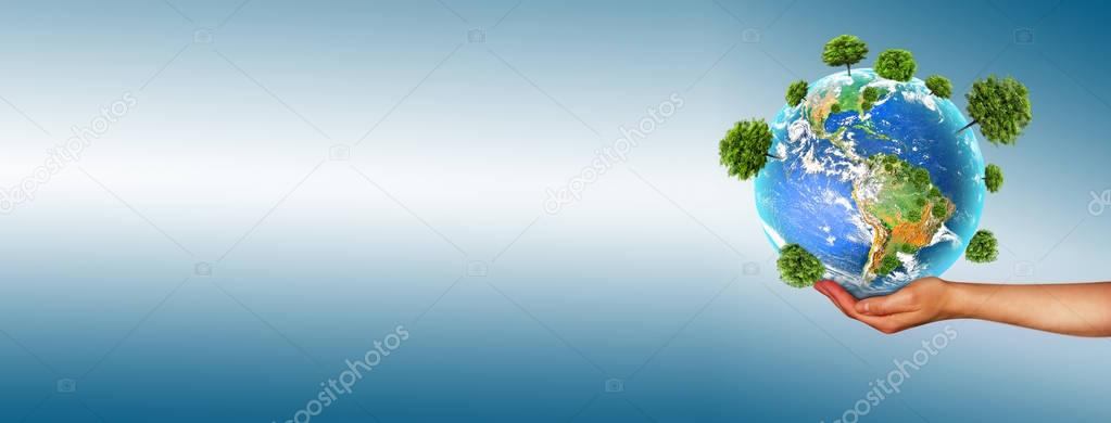 Ecological concept of the environment with the cultivation of trees on the ground in the hands. Planet Earth. Physical globe of the earth. Elements of this image furnished by NASA. 3D illustration