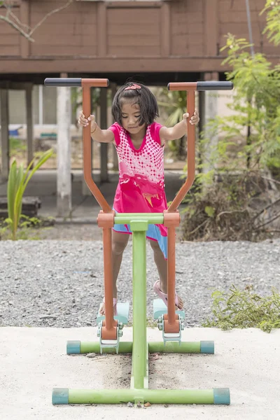 Little girl exercising outdoors — Stock Photo, Image