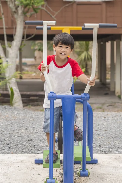 Little boy exercising outdoors — Stock Photo, Image