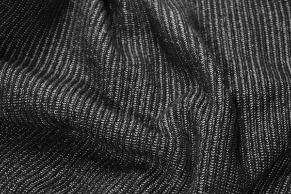 Black wrinkle knitted wool background — Stock Photo, Image