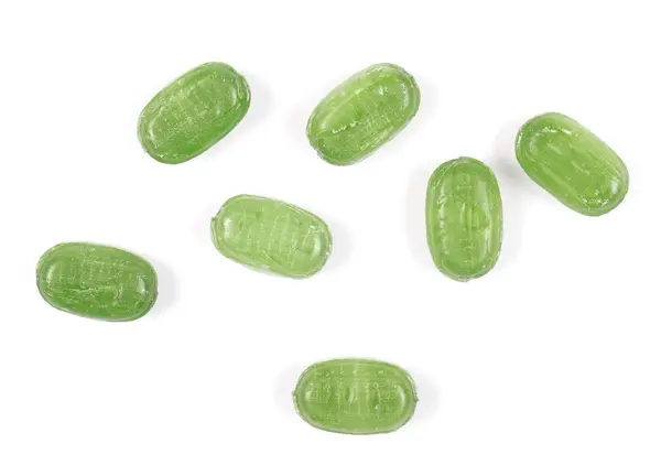 Groene snoepjes geïsoleerd op witte achtergrond — Stockfoto
