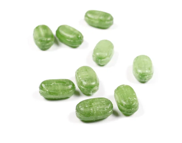 Зеленые конфеты изолированы на белом фоне — стоковое фото