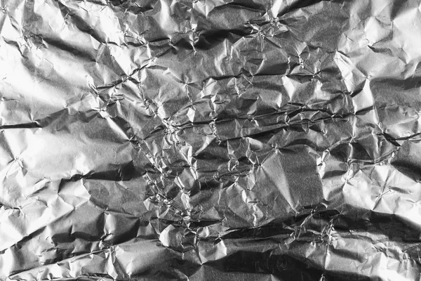 Textura de fondo de papel de aluminio plateado arrugado abstracto — Foto de Stock
