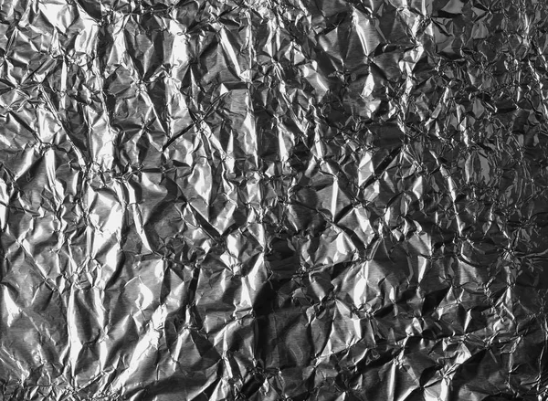 Abstract crumpled silver aluminum foil background texture — Stock Photo, Image