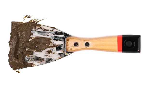 Dirty with mud metal spatula isolated on a white — Stock Photo, Image