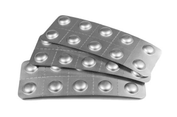 Tablety v pásu izolované na bílém — Stock fotografie