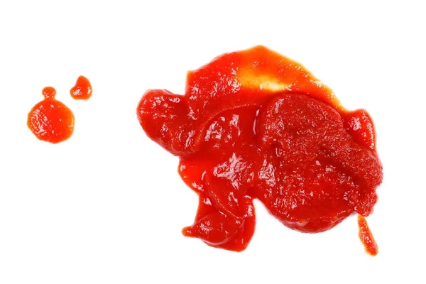 Schizzi di ketchup rosso isolati su fondo bianco, consistenza di passata di pomodoro — Foto Stock