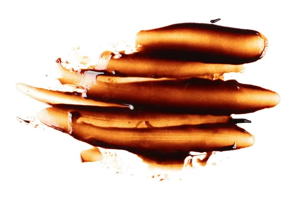 Chocolat coulé isolé sur fond blanc, avec chemin de coupe — Photo