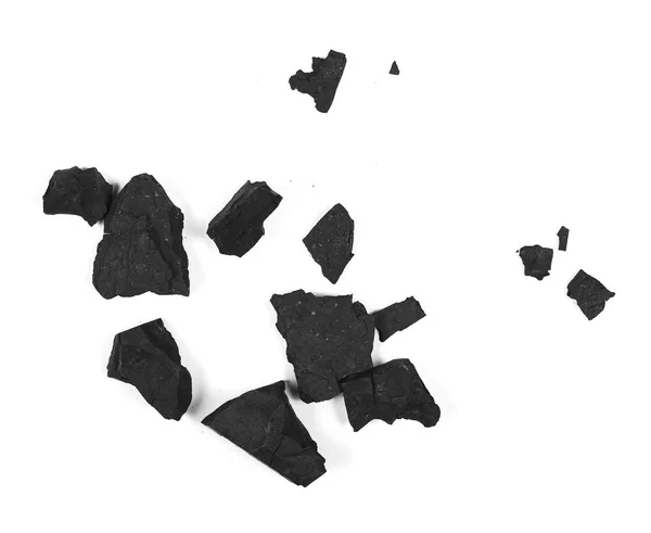 Pile charbon noir isolé sur texture blanche, vue de dessus — Photo