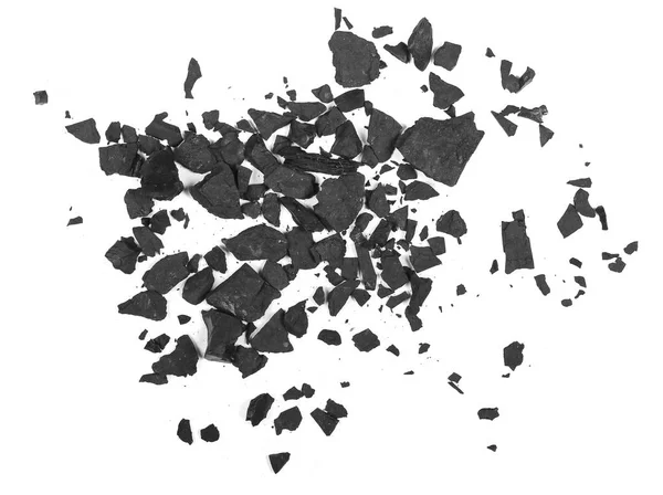 Свай черный уголь изолирован на белой текстуре, вид сверху — стоковое фото