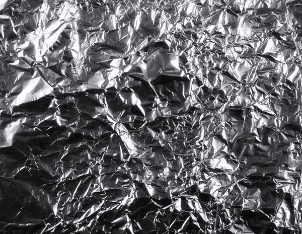 Fundo de folha de alumínio prata amassada, textura abstrata — Fotografia de Stock