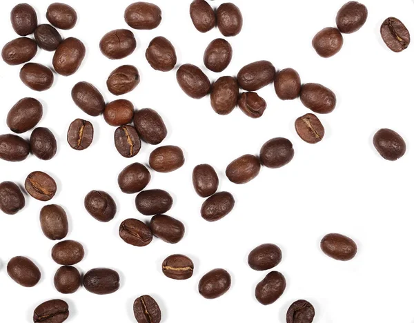 Купа кавових зерен ізольована на білому тлі і текстурі, вид зверху — стокове фото