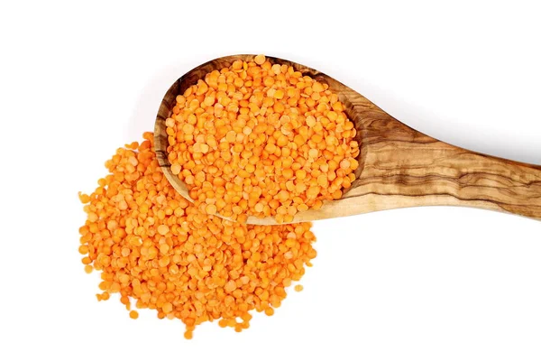Pile red lentils in wooden spoon isolated on white, top view — Stock Photo, Image