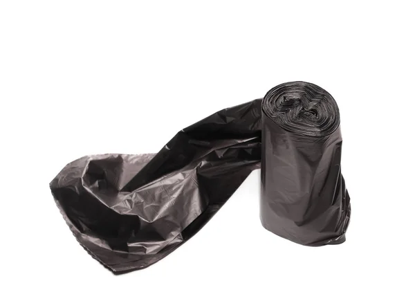 Zwarte rol plastic vuilniszakken geïsoleerd op wit — Stockfoto