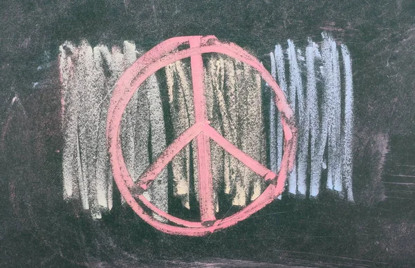 Peace symbol, sign on chalkboard, blackboard texture