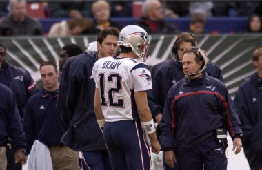 Quarterback Tom Brady and Coach Bill Bellick of the New England Patriots. clipart