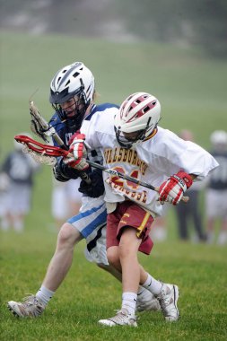 Youth lacrosse and High School Lacrosse action in games played in Central New Jersey. clipart