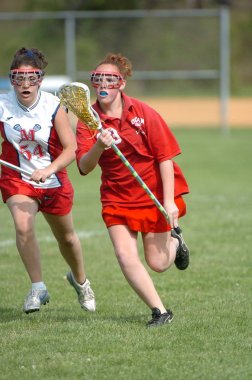 Kızlar lise Lacrosse oyunu at eylem yerel okul Merkezi New Jersey.