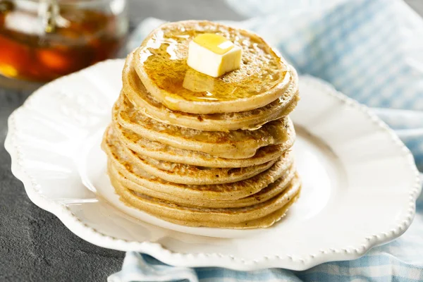 Homemade buckwheat pancakes with honey and butter