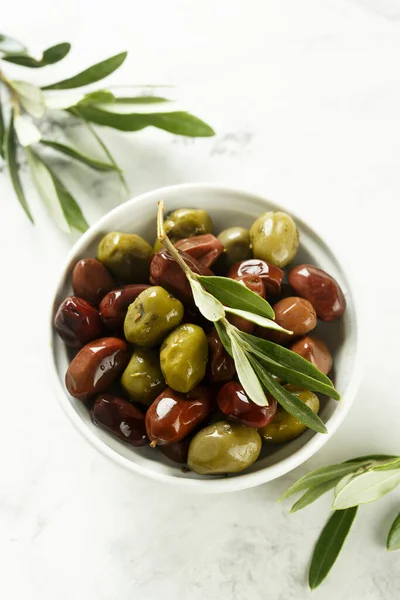 Organic Greek olives in a white bowl