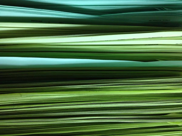 Green Pile of Papers Background