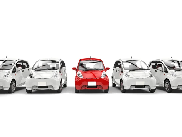 Compact white electric cars in a row - red stands out — Stock Photo, Image