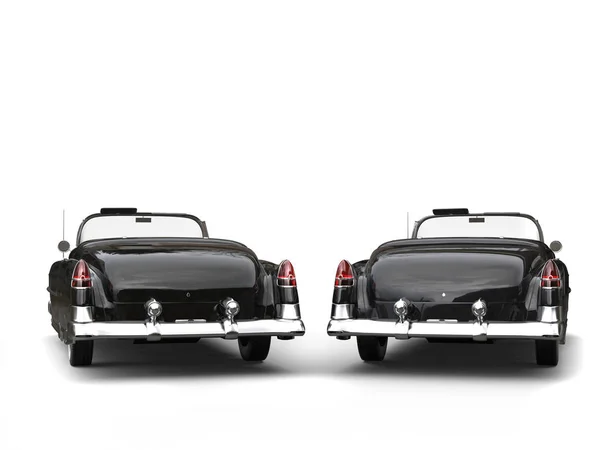 Two awesome black vintage cars - back view — Stock Photo, Image
