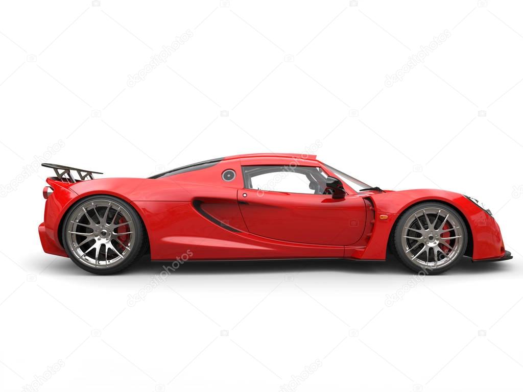 Cherry bomb red sports supercar - side view