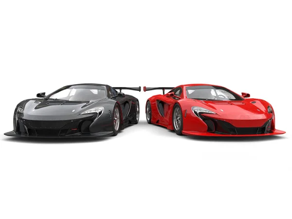 Black and red great supercars side by side — Stock Photo, Image