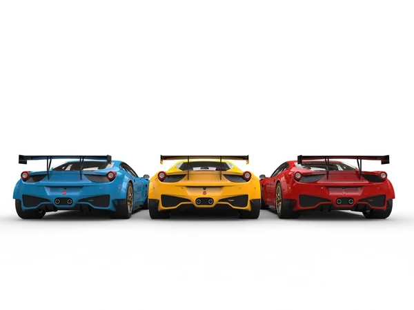 Modern luxury sportscars in red, yellow and blue colors - back view — Stock Photo, Image