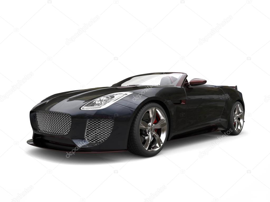 Black fast convertible sports car with redish highlight