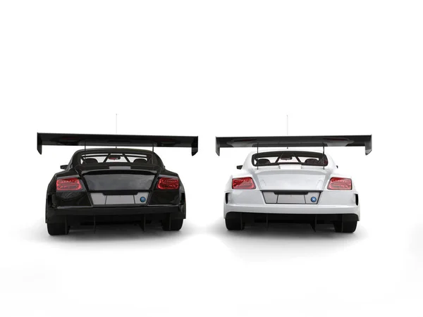 Czarno-białe nowoczesne super samochody - obok siebie - widok z tyłu — Zdjęcie stockowe