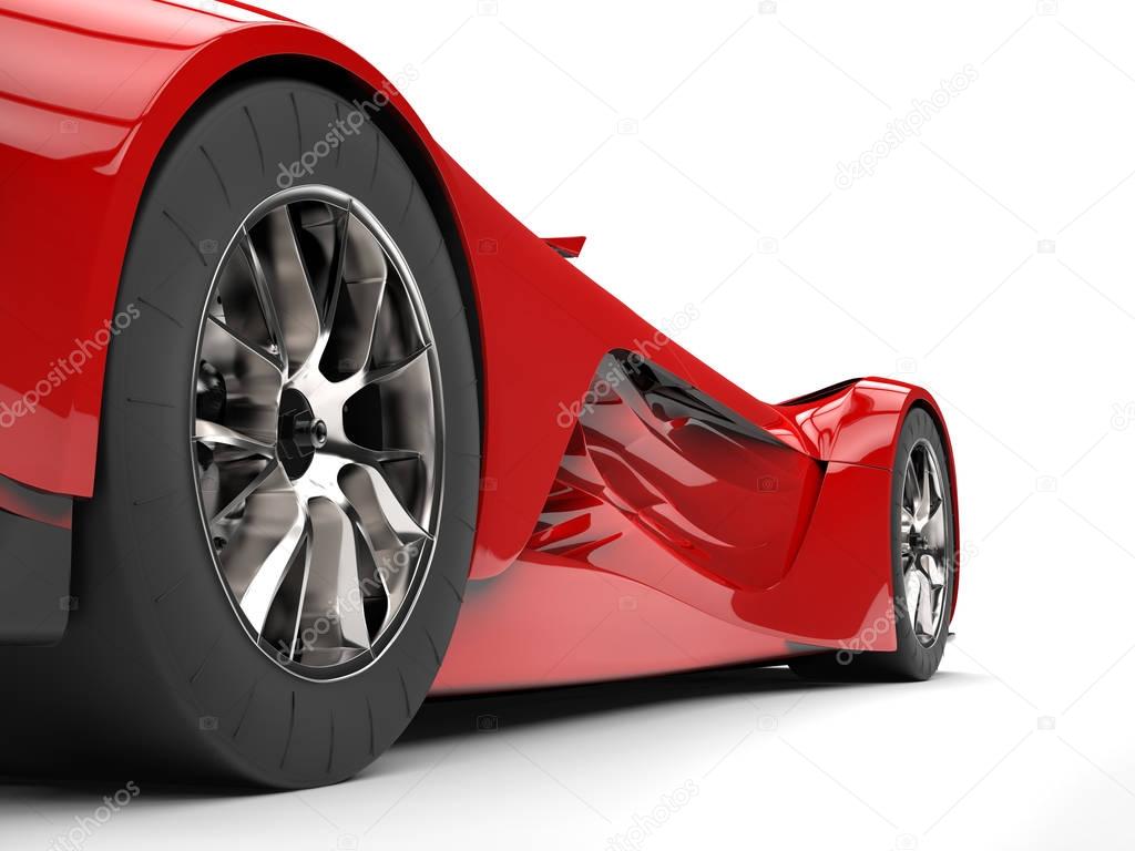 Persian red modern concept super car - rear wheel closeup shot