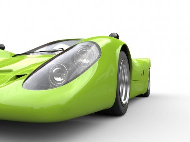 Süper yeşil vintage yarış süper araba - Far portre vurdu