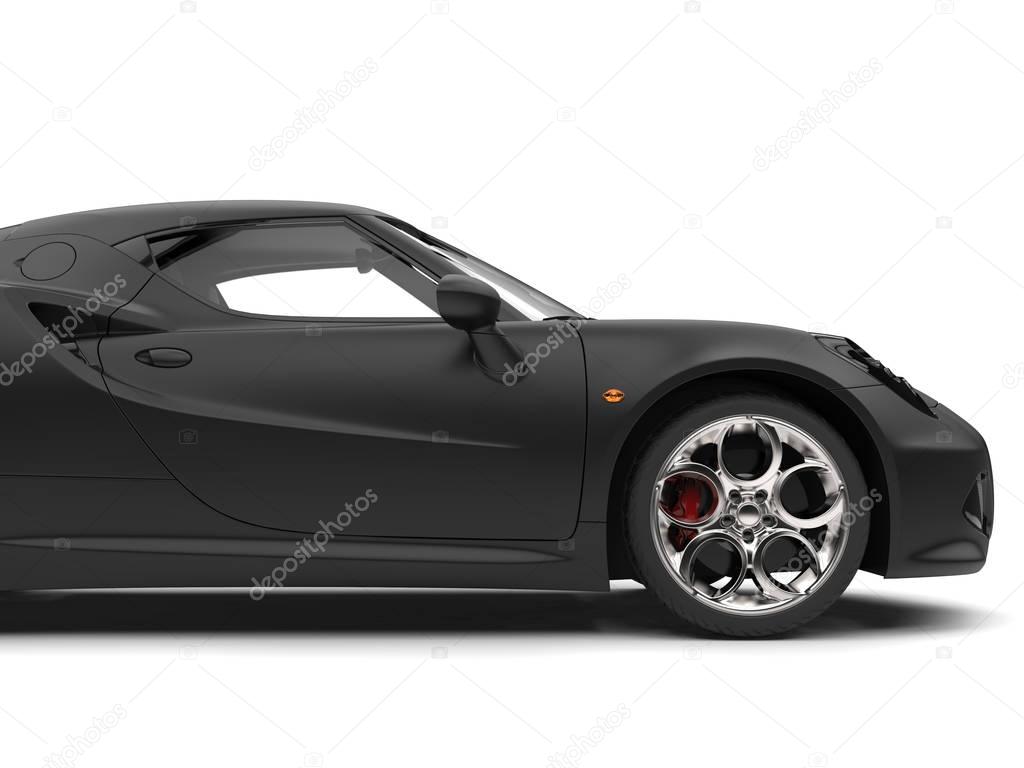 Superb matte black sports car - side view cut shot