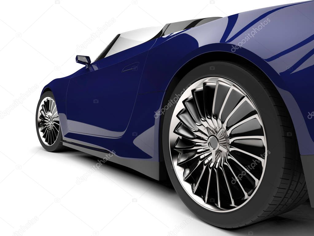 Midnight blue modern cabriolet sports car - rear wheel closeup shot