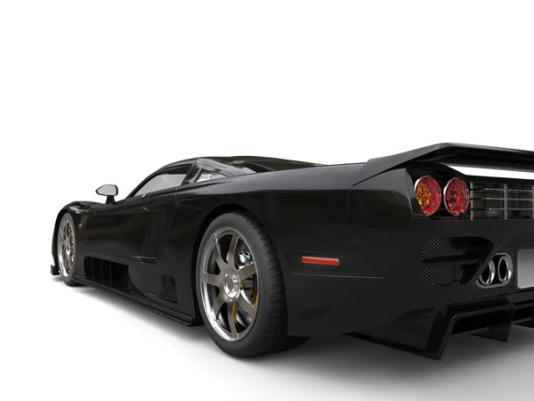 Medianoche negro moderno super deportivo coche - rueda trasera tiro de cerca —  Fotos de Stock
