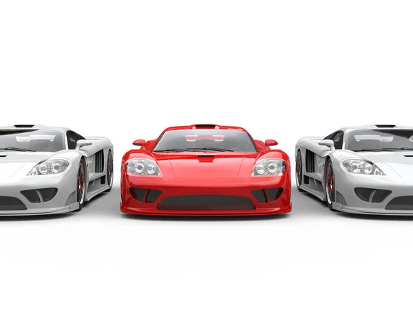 Fire red modern super race car in between white super cars — Stock Photo, Image